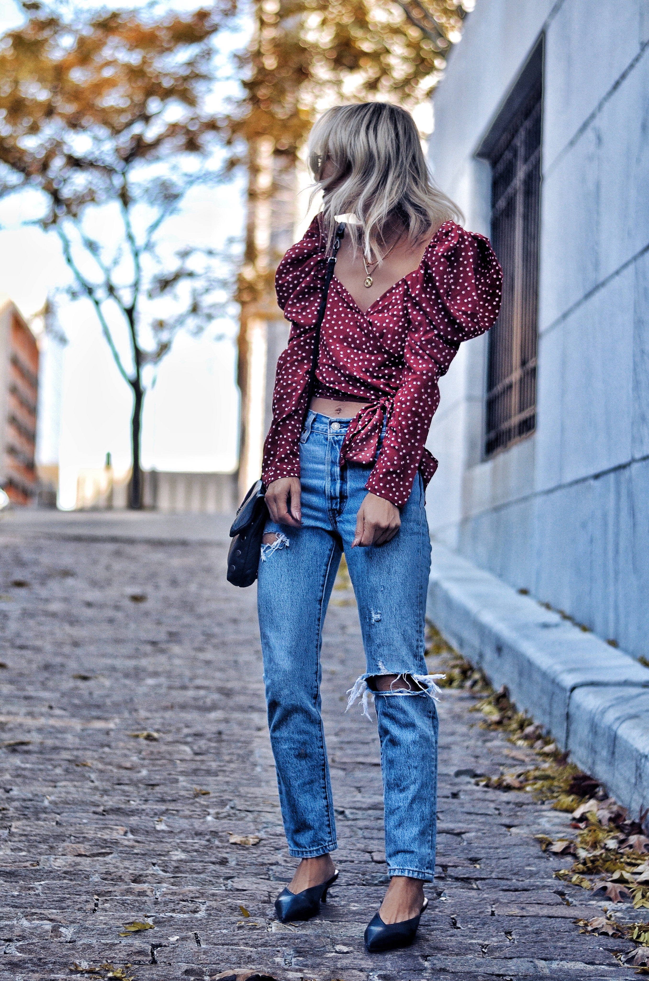 red and white polka dot wrap top