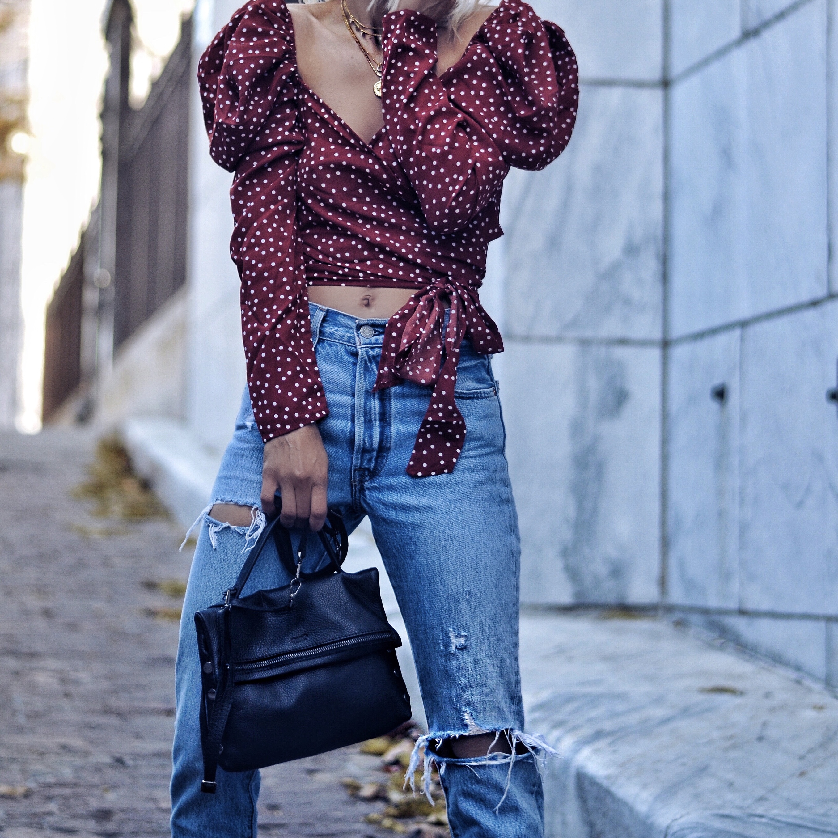 red and white polka dot wrap top